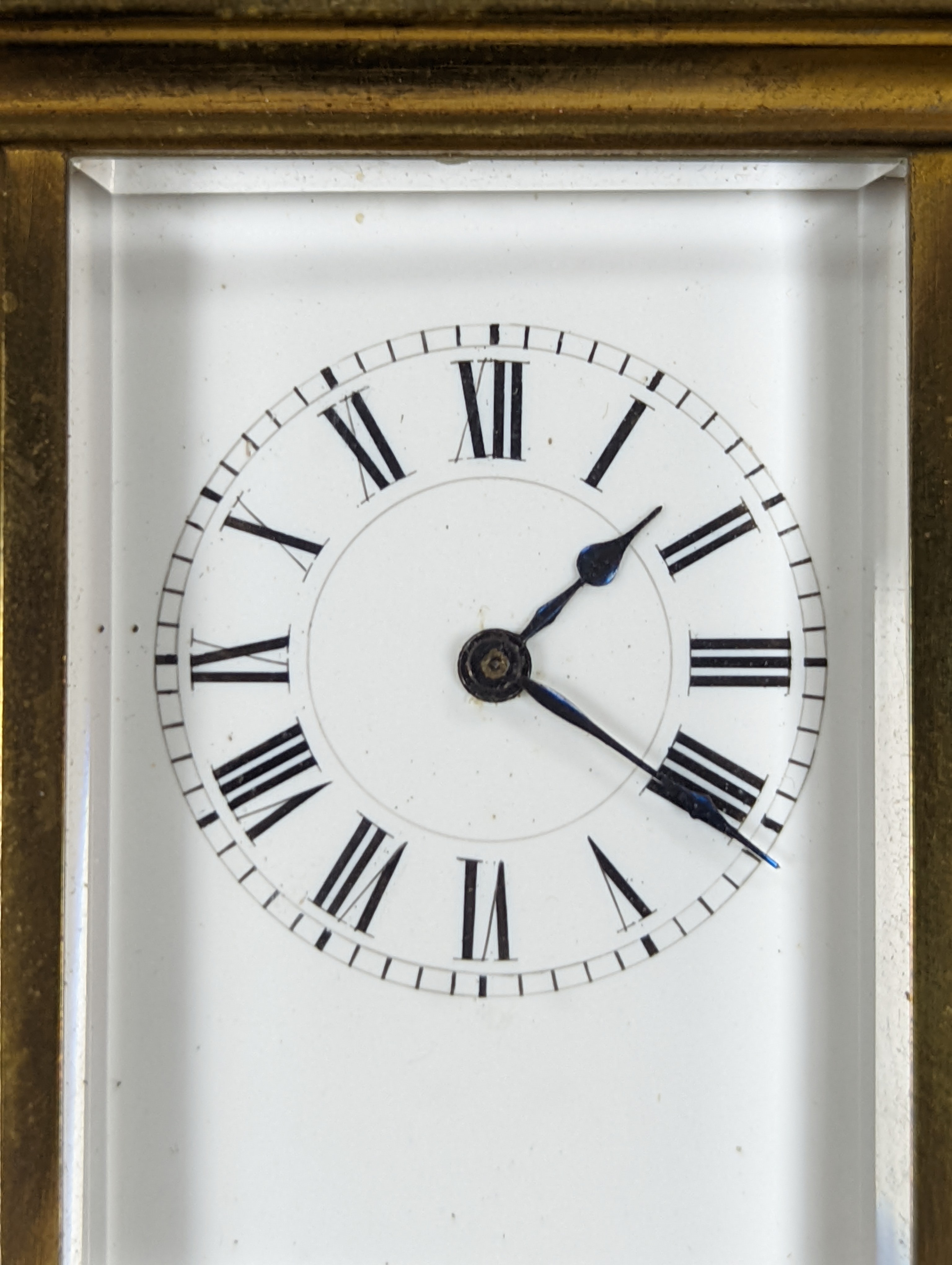 A Henri Jacot brass miniature carriage timepiece, 9.7 cm high with the handle up, cased